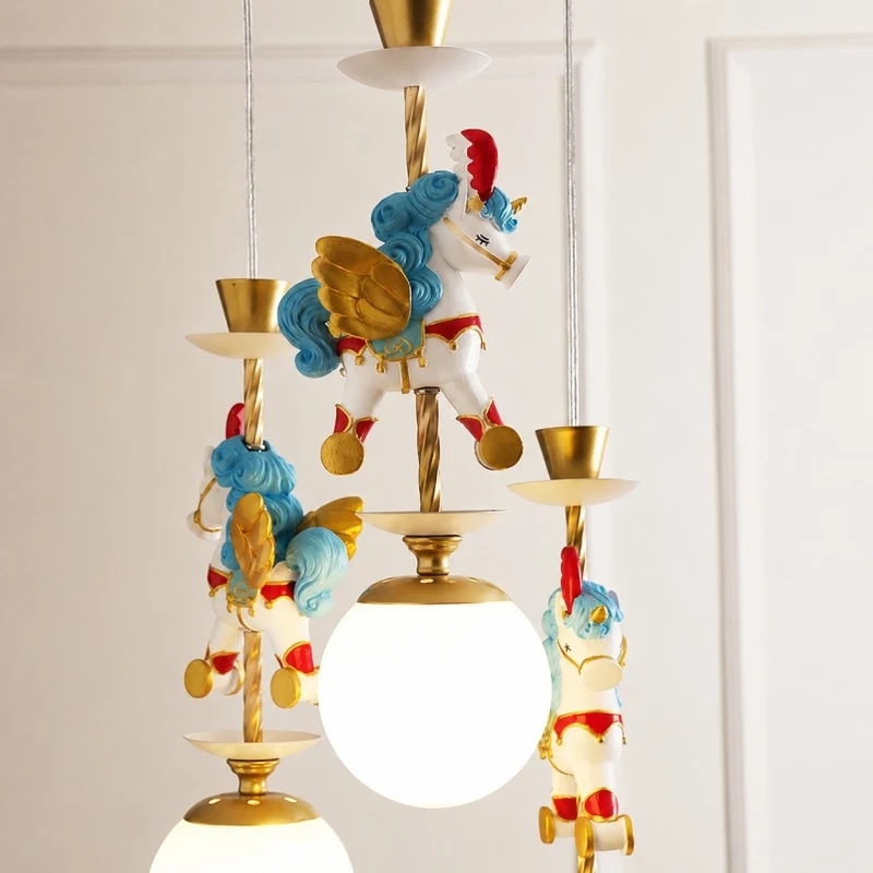 Blue unicorn ornament beside illuminated globe shade