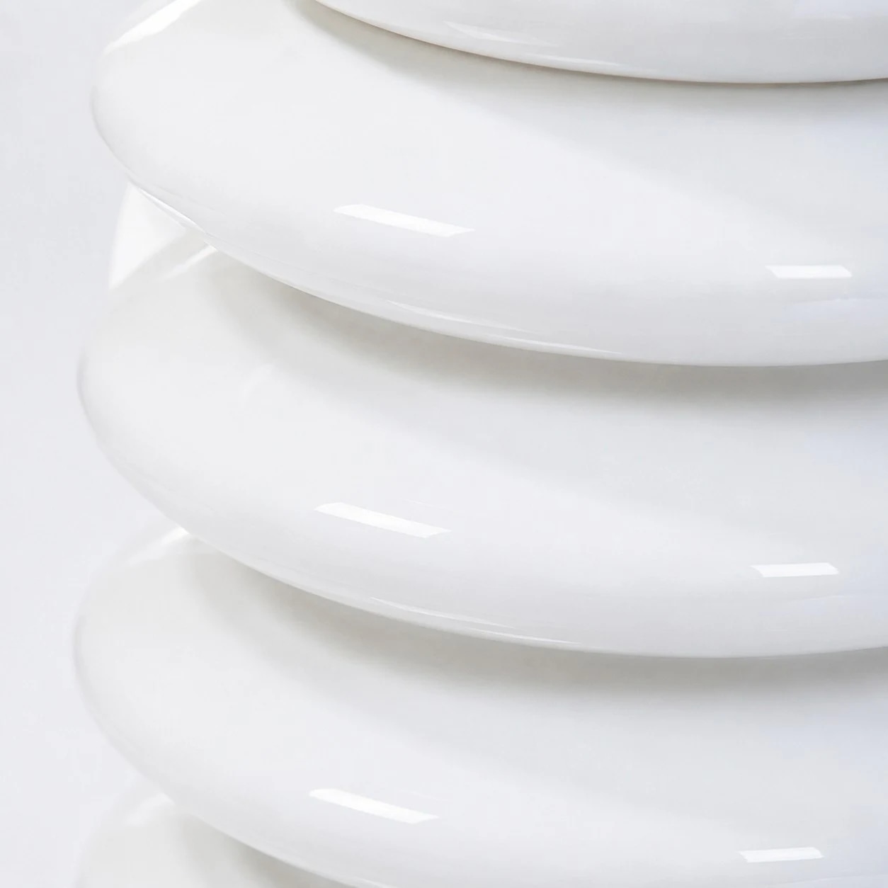 Macro view of glossy white ribbed glass texture
