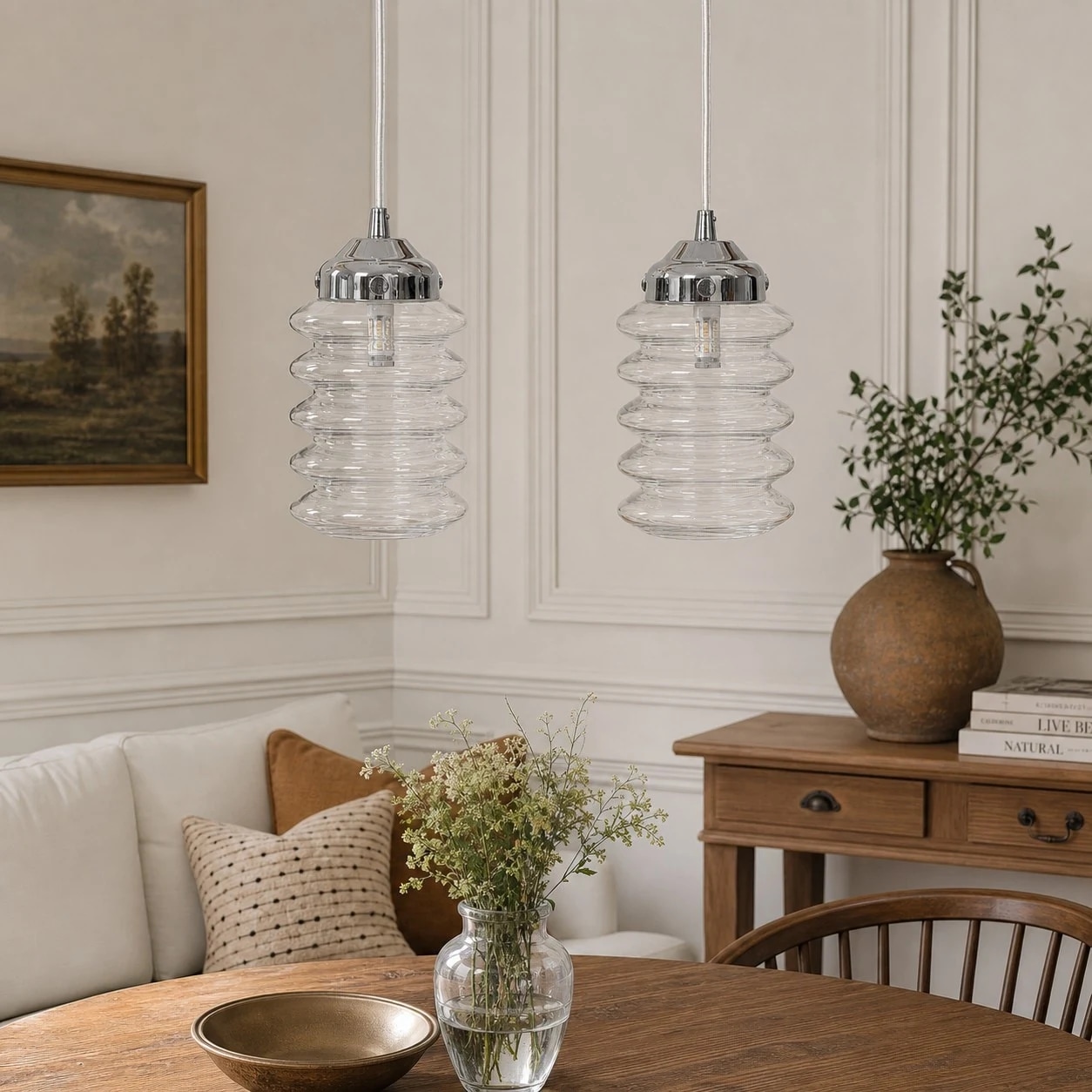 Transparent ribbed glass pendants styled above a warm residential dining and sitting area