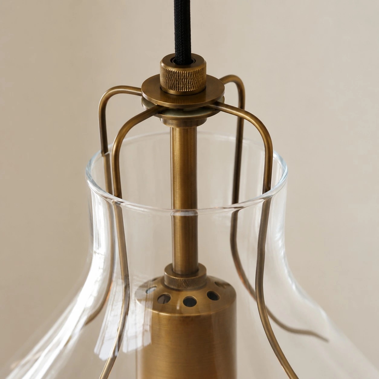 Close angled view of the glass shade and bulb socket