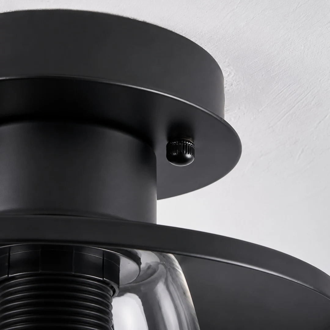Close view of black metal mount and glass shade