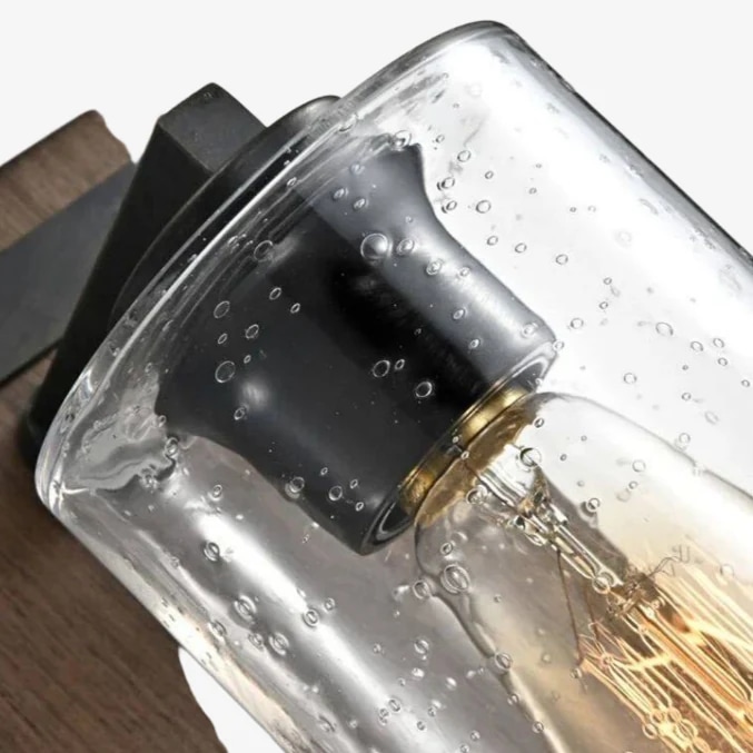 Close detail of top metal socket and seeded clear glass shade