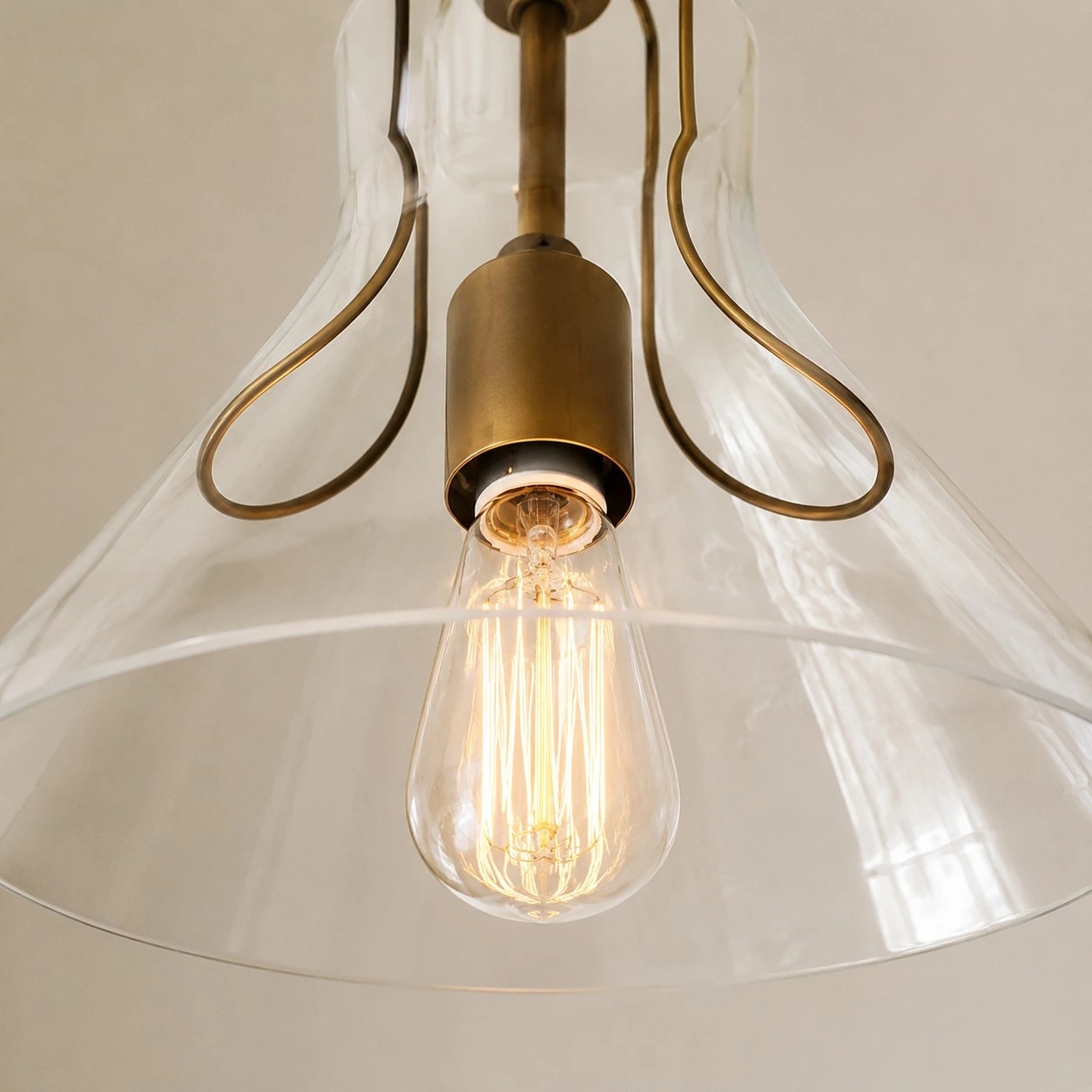 Close view of the clear umbrella glass shade and inner holder