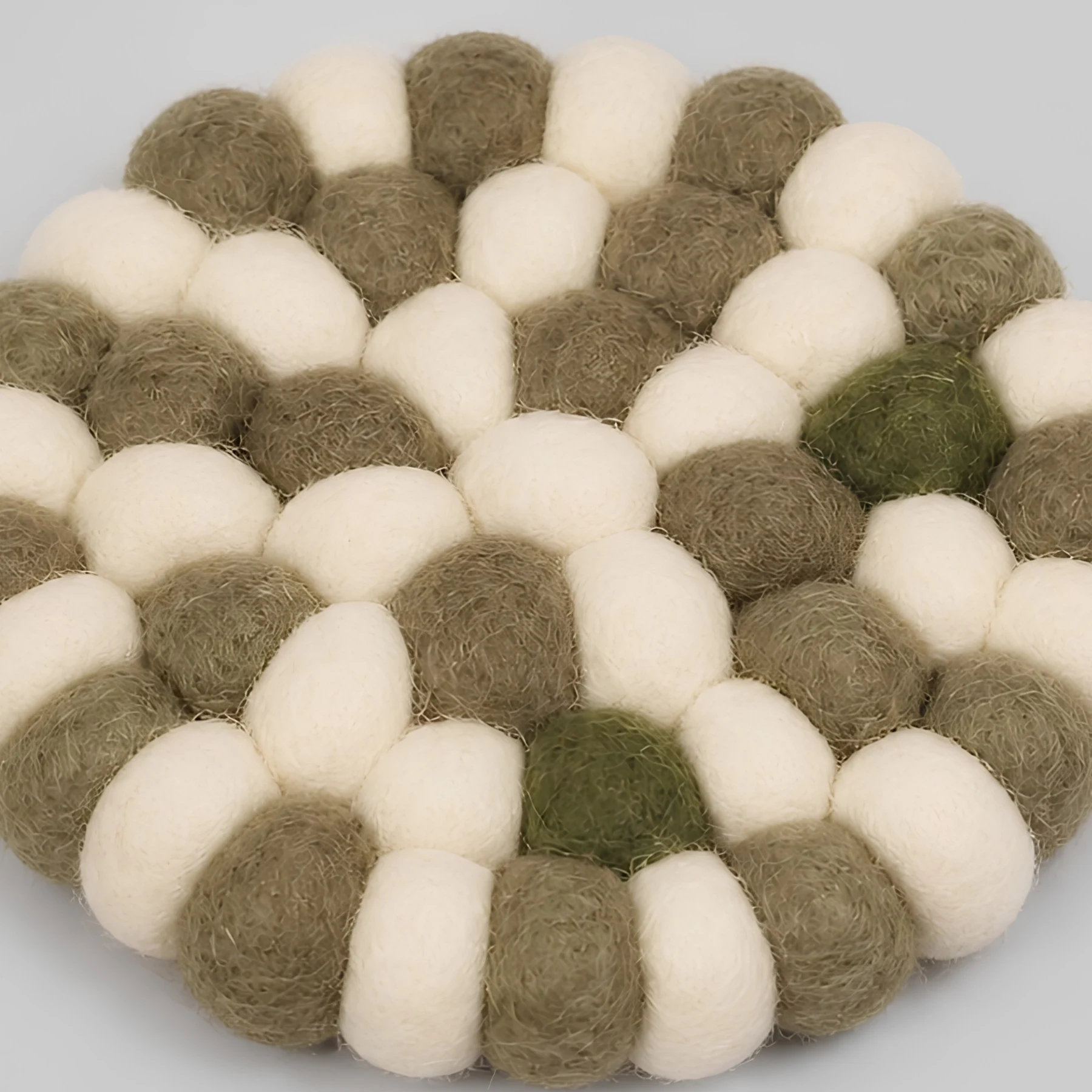 Close view of handmade wool felt ball texture